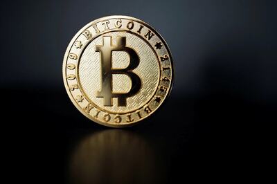 Bitcoin Drops to Over 2-Month Low After Report Binance Under U.S. Probe, Tesla Move