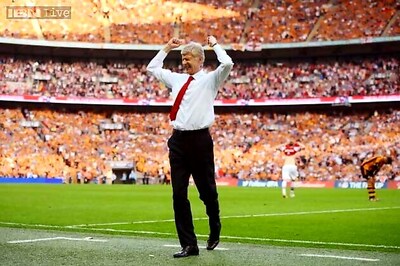 Arsene Wenger signs new three-year deal at Arsenal
