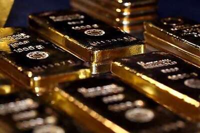 Gold eases as dollar firms; virus fears cap losses