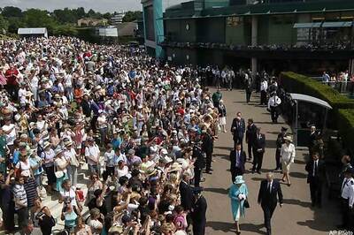 After 33 years, Queen arrives at Wimbledon