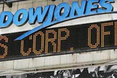 Dow falls below 7,000 after AIG's massive loss