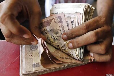 Rupee surges to 10-month high, ends almost flat at 60.05 vs US dollar