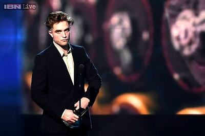 Robert Pattinson shamelessly grabs girlfriend FKA Twigs' back in public