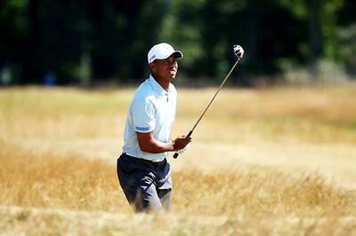 Tiger Woods in the mix on another sunny day at Muirfield