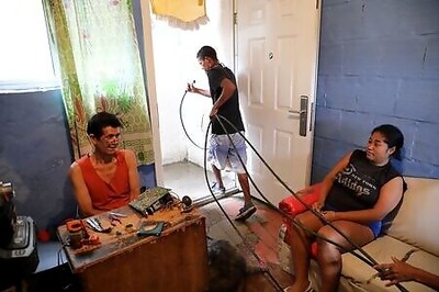 Priced out of services, Venezuelans turn creative for water and gas