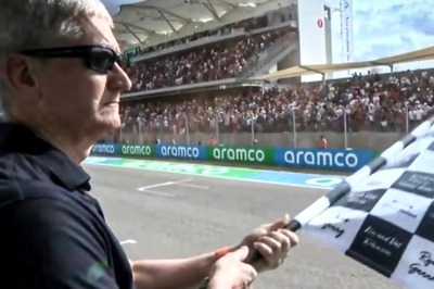 Apple CEO Tim Cook Waves Checkered Flag At Formula 1 GP