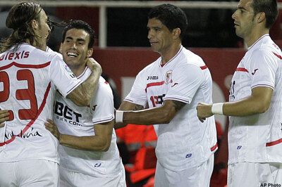 Sevilla beats 10-man Valencia 2-0 in Spain