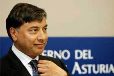 Mittal mellows, wants minority stake