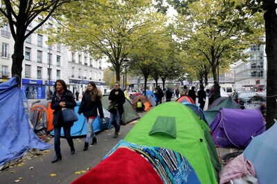 French President Vows to Clear Paris Streets of Migrant Camp