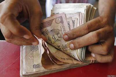 Rupee up 35 paise vs US dollar at 63.03; logs 4th straight yearly drop in 2014