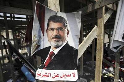 Muslim Brotherhood chief Mohamed Badie vows sacrifice to defend Morsi