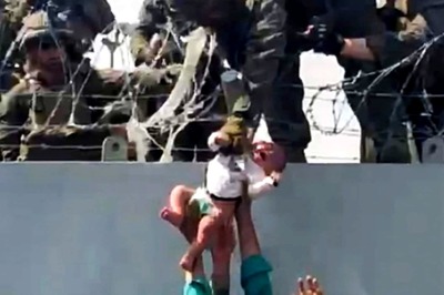 Lifting Infant Over Wire-topped Wall, Babies in Arms: Viral Footage of US Marine Captures Kabul Chaos