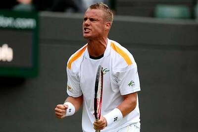 Hewitt beats Wawrinka to advance at Wimbledon