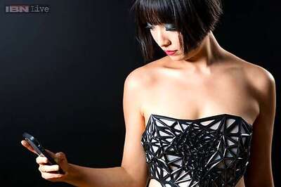 A dress that becomes see-through as you share personal data online