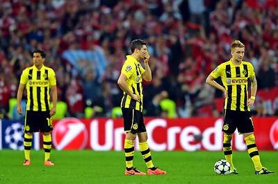 Dortmund advance to Champions League quarters despite 2-1 loss