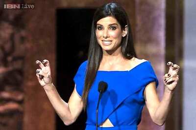Man accused of stalking Sandra Bullock charged with stockpiling guns