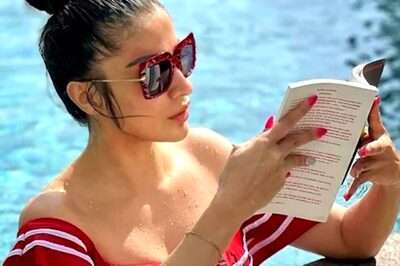Actor Raai Laxmi Reads a Book By Poolside in Red Bikini. Check Pictures