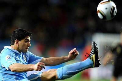 Suarez returns to Uruguay squad after serving biting ban