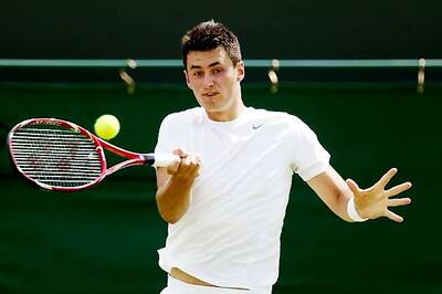 Bernard Tomic advances with win over James Blake at Wimbledon