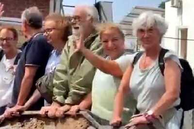 Video Of Foreign Tourists Being Driven Around Flooded Vadodara On Bulldozer’s Scoop Goes Viral