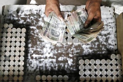 Rupee closes 26 paise higher at 66.22 against US dollar
