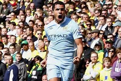 Tevez hat-trick helps Man City close in on top