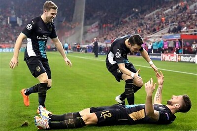 Giroud scores hat-trick as Arsenal beat Olympiakos 3-0 to qualify for last 16 of Champions League