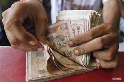 Rupee gains 5 paise against dollar
