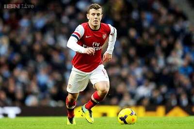 Arsenal's Wilshere charged for abusive gesture to Manchester City fans