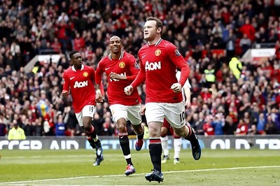 Rooney double helps Man United thump Villa 4-0